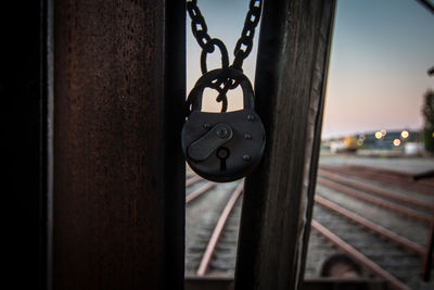 Close-up of padlocks hanging on metal