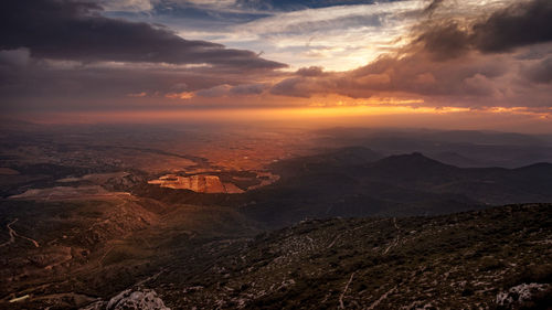 Scenic view of dramatic landscape during sunset