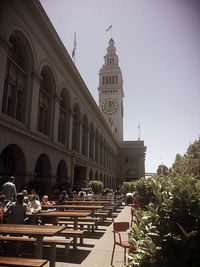 People in city against clear sky