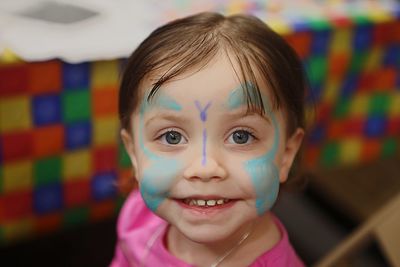 Close-up portrait of cute girl with painted face