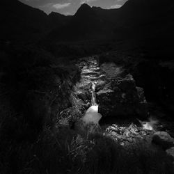 Water flowing through rocks on land