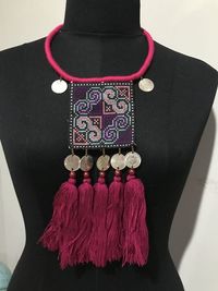 Close-up of red text hanging on wall