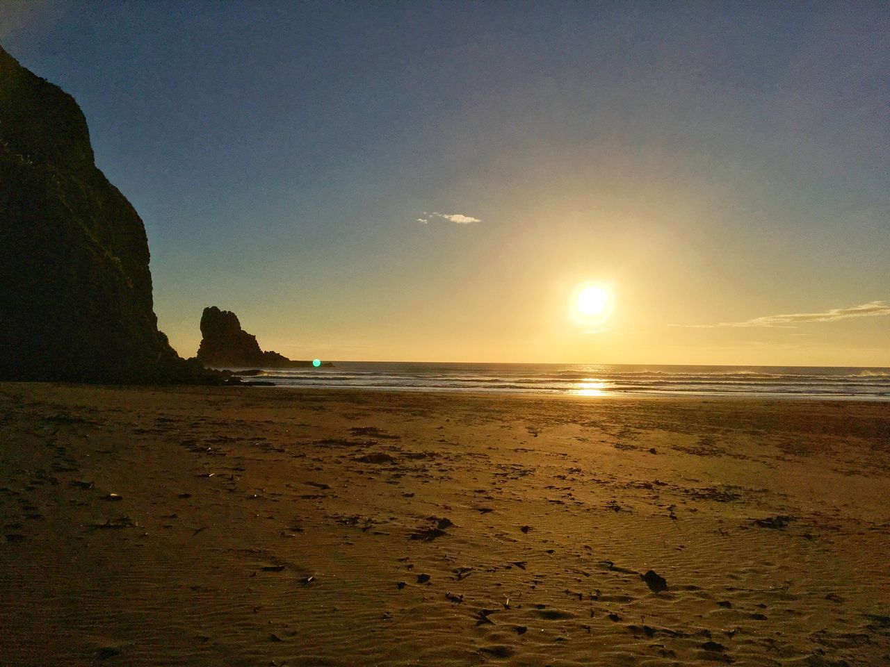 sea, beach, nature, beauty in nature, sand, scenics, water, tranquility, shore, tranquil scene, sunset, sun, sky, no people, outdoors, travel destinations, vacations, horizon over water, day