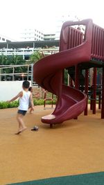 Boy playing in tunnel