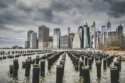 Panoramic shot of modern buildings against sky in city