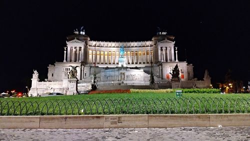 Facade of historic building at night