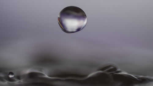 Close-up of bubbles against sky