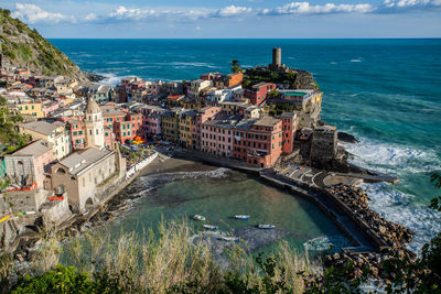 High angle view of residential buildings by sea