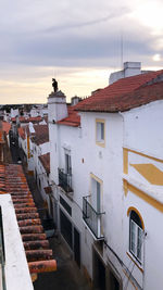 High angle view of residential buildings against sky