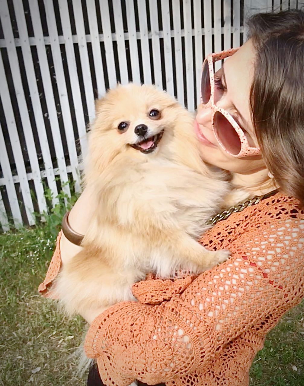 PORTRAIT OF WOMAN WITH DOG AT CAMERA