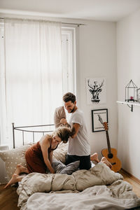 Young couple on bed at home