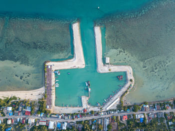 High angle view of crowd in city against sea