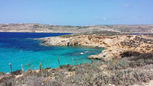 Scenic view of sea against blue sky