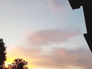 Low angle view of silhouette trees against sky during sunset