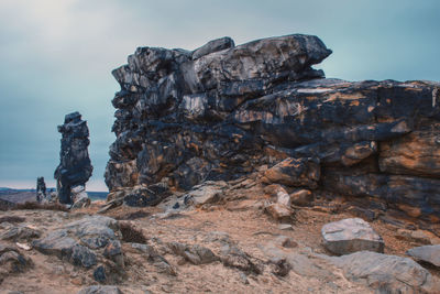 Rock formation on land against sky