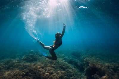 Woman swimming in sea