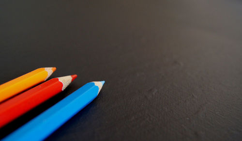 Close-up of colored pencils on table