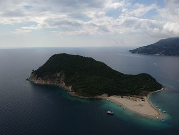 Scenic view of sea against cloudy sky