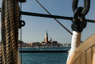 Sailboats in sea against sky