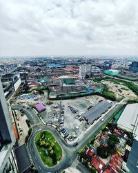 High angle view of city street and buildings against sky