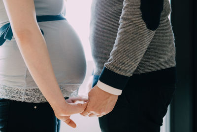 Close-up of couple holding hands