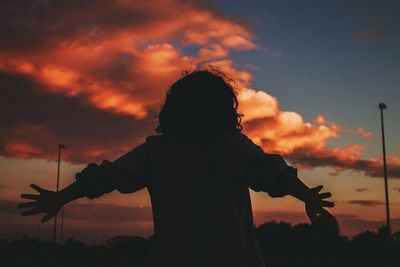 Silhouette of man against sky