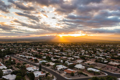 High angle view of townscape against sky during sunset