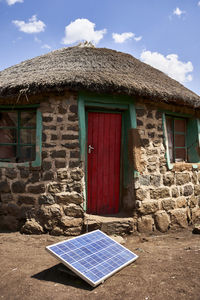 Traditional house with a solar panel, lesotho