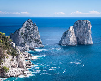 Panoramic view of sea against blue sky