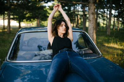 Mid adult woman sitting in car