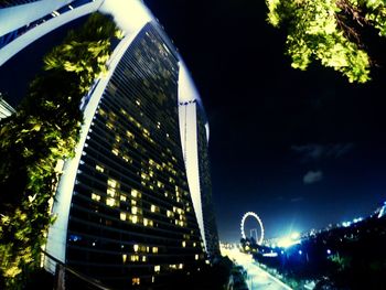 Low angle view of illuminated street light at night