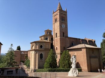 Low angle view of historic building against clear blue sky