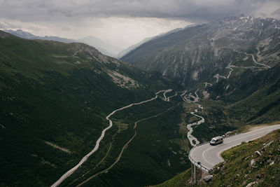 High angle view of road amidst mountains against sky