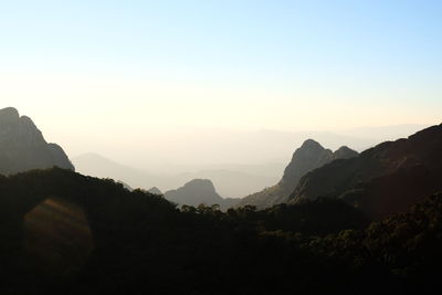 Scenic view of silhouette mountains against clear sky