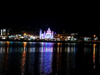 Illuminated city at waterfront