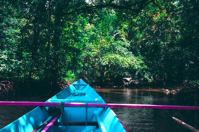 Scenic view of lake by trees in forest