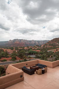 High angle view of swimming pool against cloudy sky