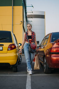 Shopping, sale concept. young stylish blonde woman with many shopping bags and coffee go 