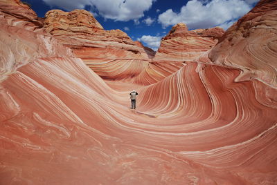 Full length of man standing on desert against sky