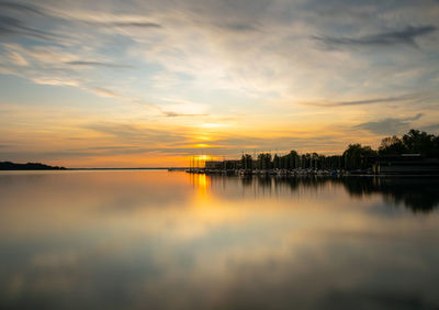 Scenic view of lake against sky during sunset