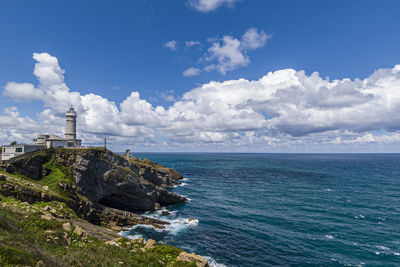 Scenic view of sea and buildings against sky