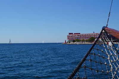 Scenic view of sea against clear blue sky