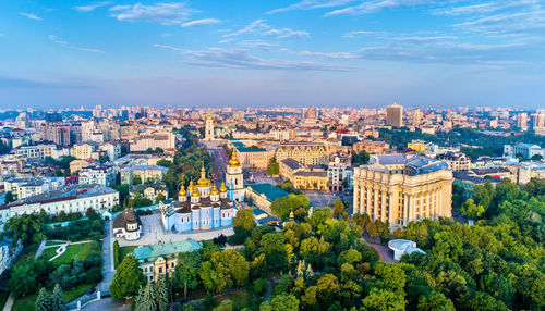 High angle view of trees and buildings against sky