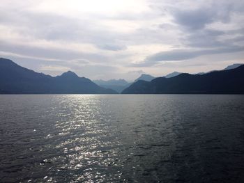 Scenic view of lake against cloudy sky