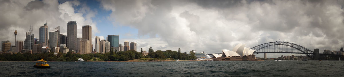 City skyline against cloudy sky