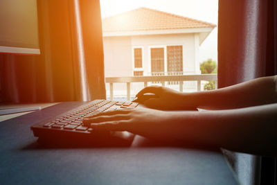 Man using mobile phone at home