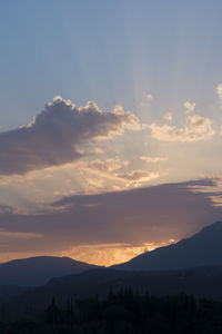 Scenic view of mountains against dramatic sky