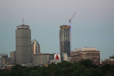 Skyscrapers in city against clear sky