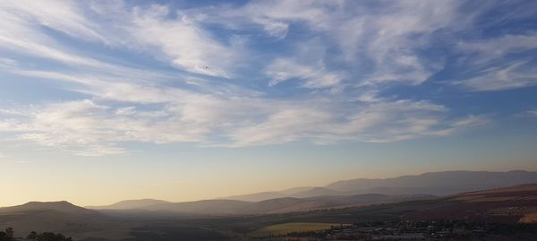 Scenic view of mountains against sky during sunset