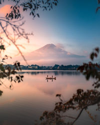 Scenic view of lake against sky during sunset